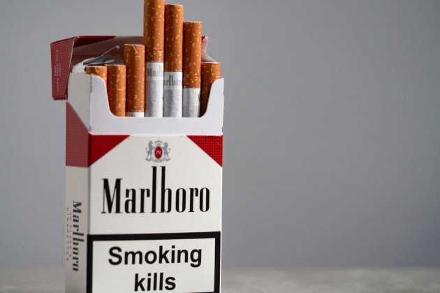Philip Morris зупиняє інвестиції та скорочує виробництво у Російській Федерації